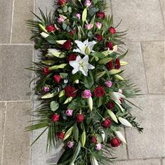 Red and Pink Roses with White Lily Coffin Spray