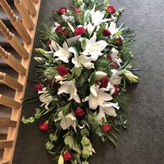 White Lily, Green Mollucella and Red Roses