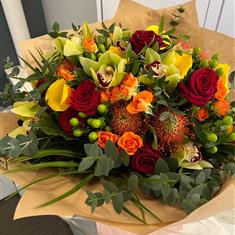 Extra Large Cymbidium and Orange spray Rose hand tied