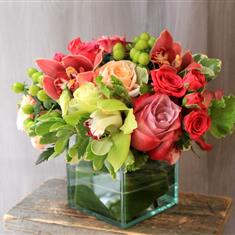 Table Arrangement With Green and Orange Cymbidium Orchids