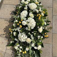 Large, white and yellow coffin spray